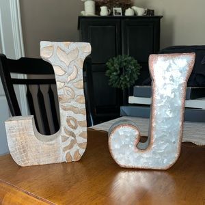 Pair of decorative letter Js